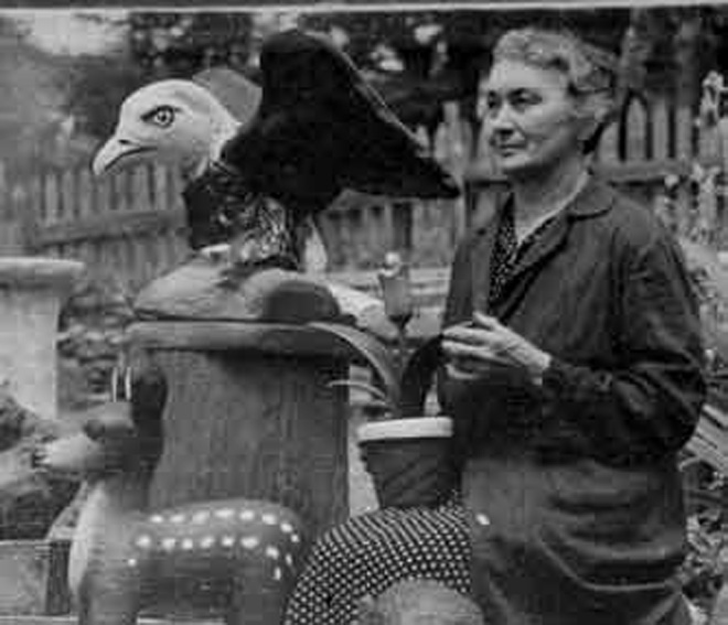 Sophie standing with her best loved carving, her bald eagle. She was also proud of her cormorant, woodpecker, painted totem pole carved from the vertebrae of a sea lion, a monkey, and a weasel.