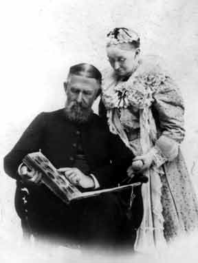 Rev. Wilson and wife reading